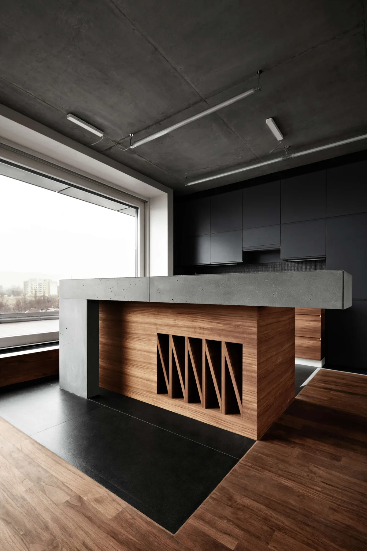 Beton architektoniczny w kuchni — ściana nad blatem