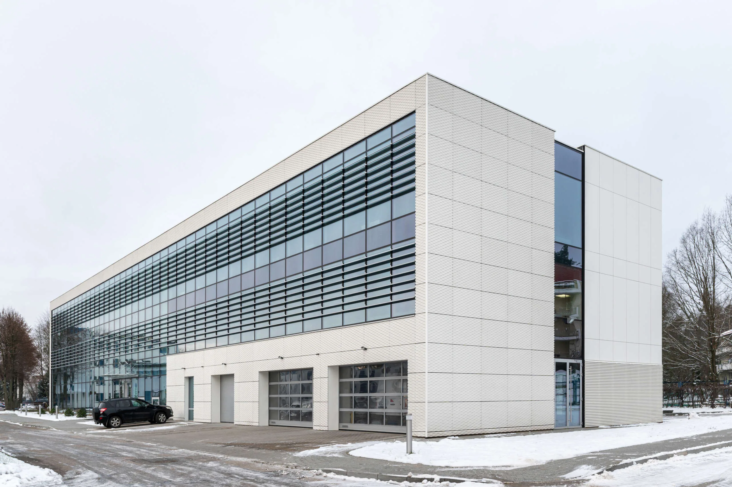 Elewacja z betonu architektonicznego concreAte pure płyty betonowe z wklęsłodrukiem RECKLI Gascogne 100x150cm — PWiK / Olsztyn